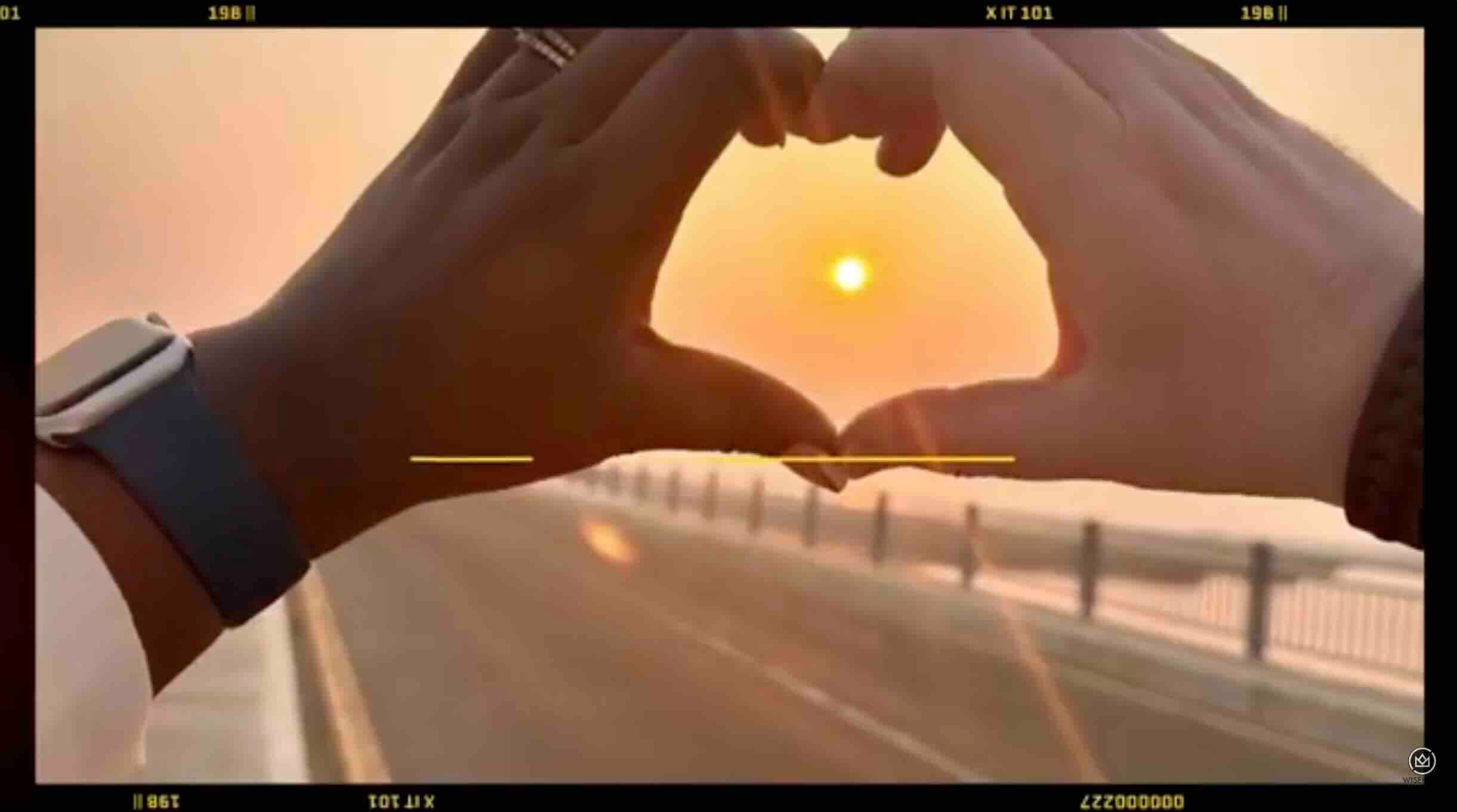 Wisekash wedding highlights video thumbnail of holding hands in a heart